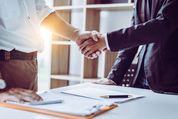 Business handshake suit desk documents