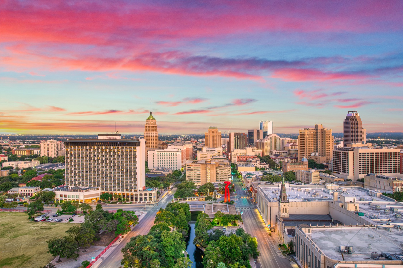 Downtown-skyline pink-sunrise-clouds aerial-view high-rises, San Antonio