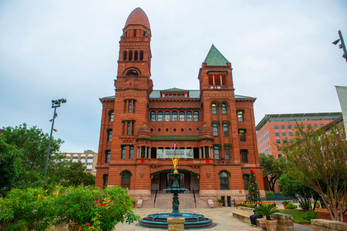 Red-sandstone-building clock-tower fountain Romanesque-architecture, San Antonio